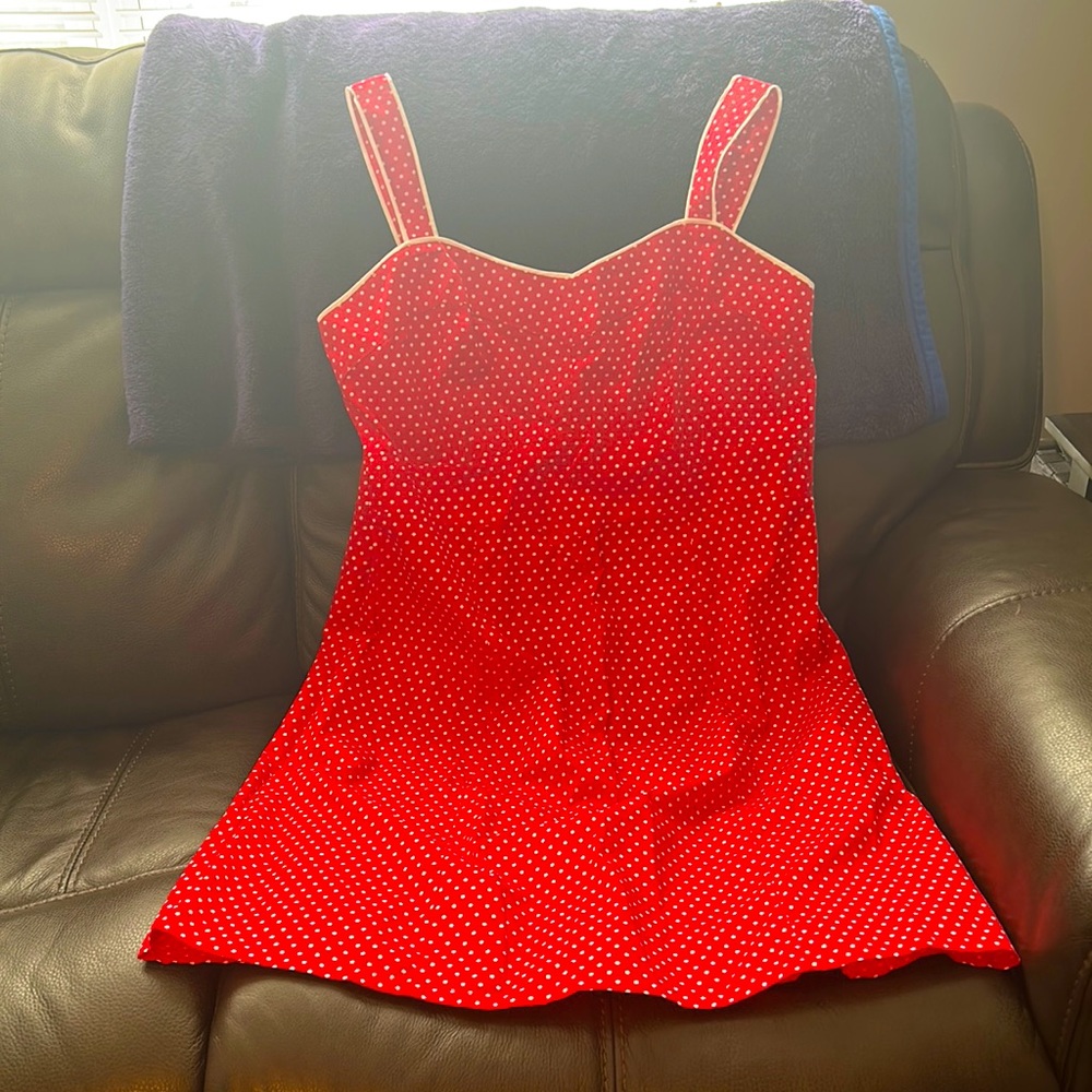 This is a red and white polka dot dress, size 16, the brand is Faded Glory